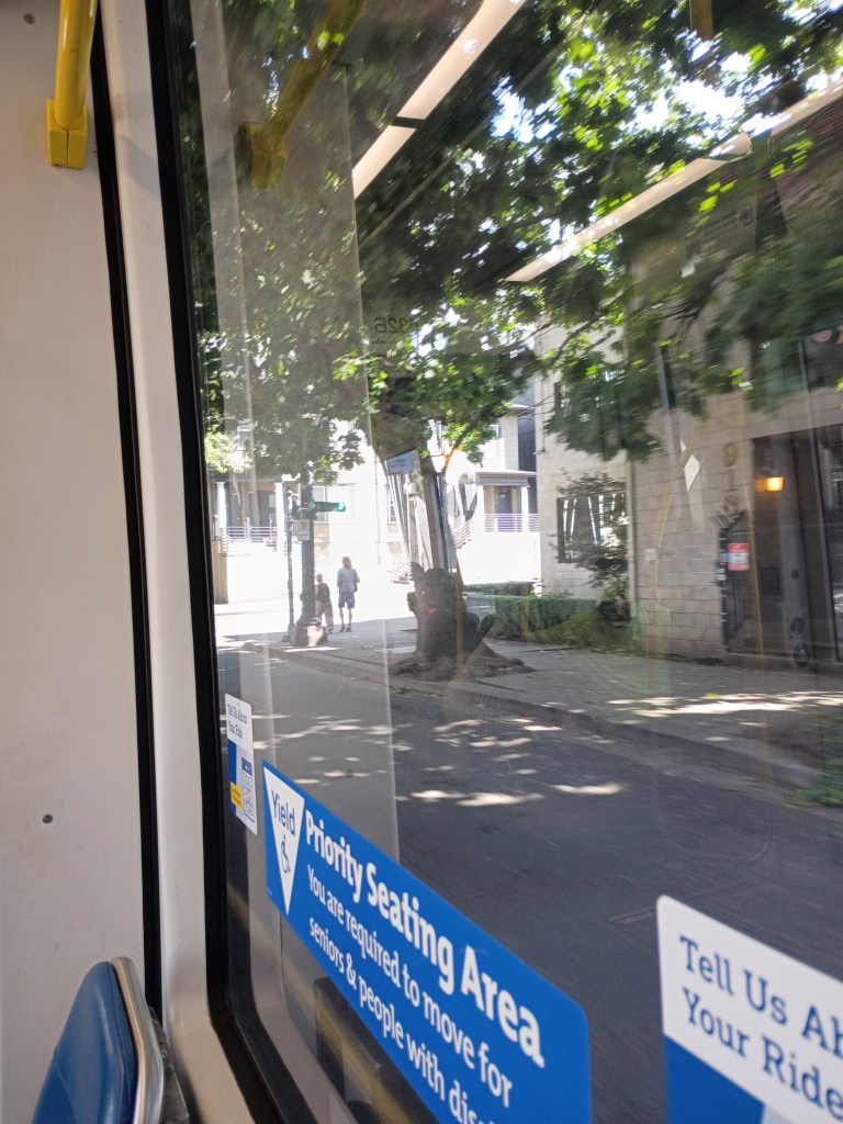 A picture through the window of a max train in goose hollow going toward providence park